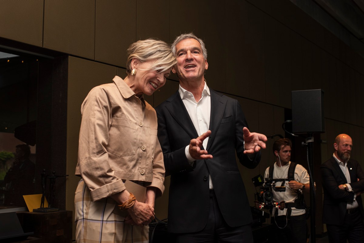 Two people share a laugh during the anniversary programme.
