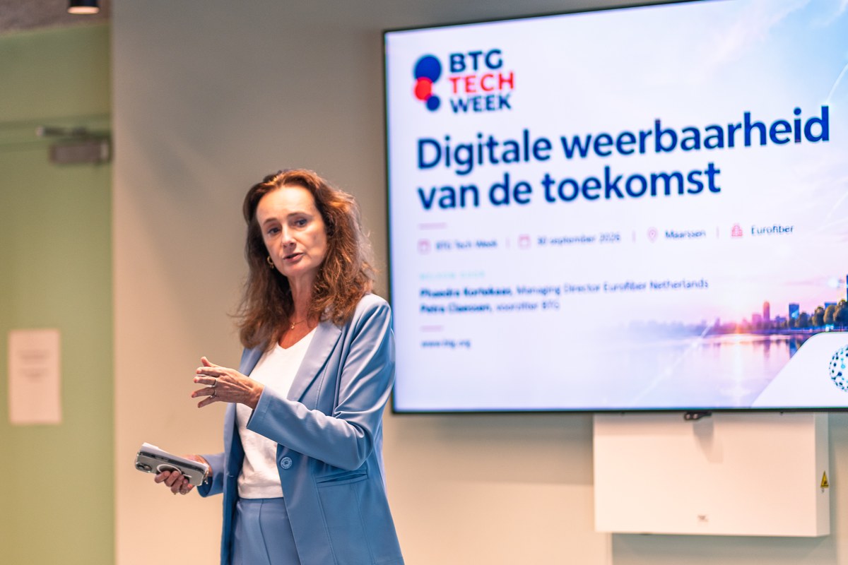 A speaker introduces digital resilience beside a BTG Tech Week screen.