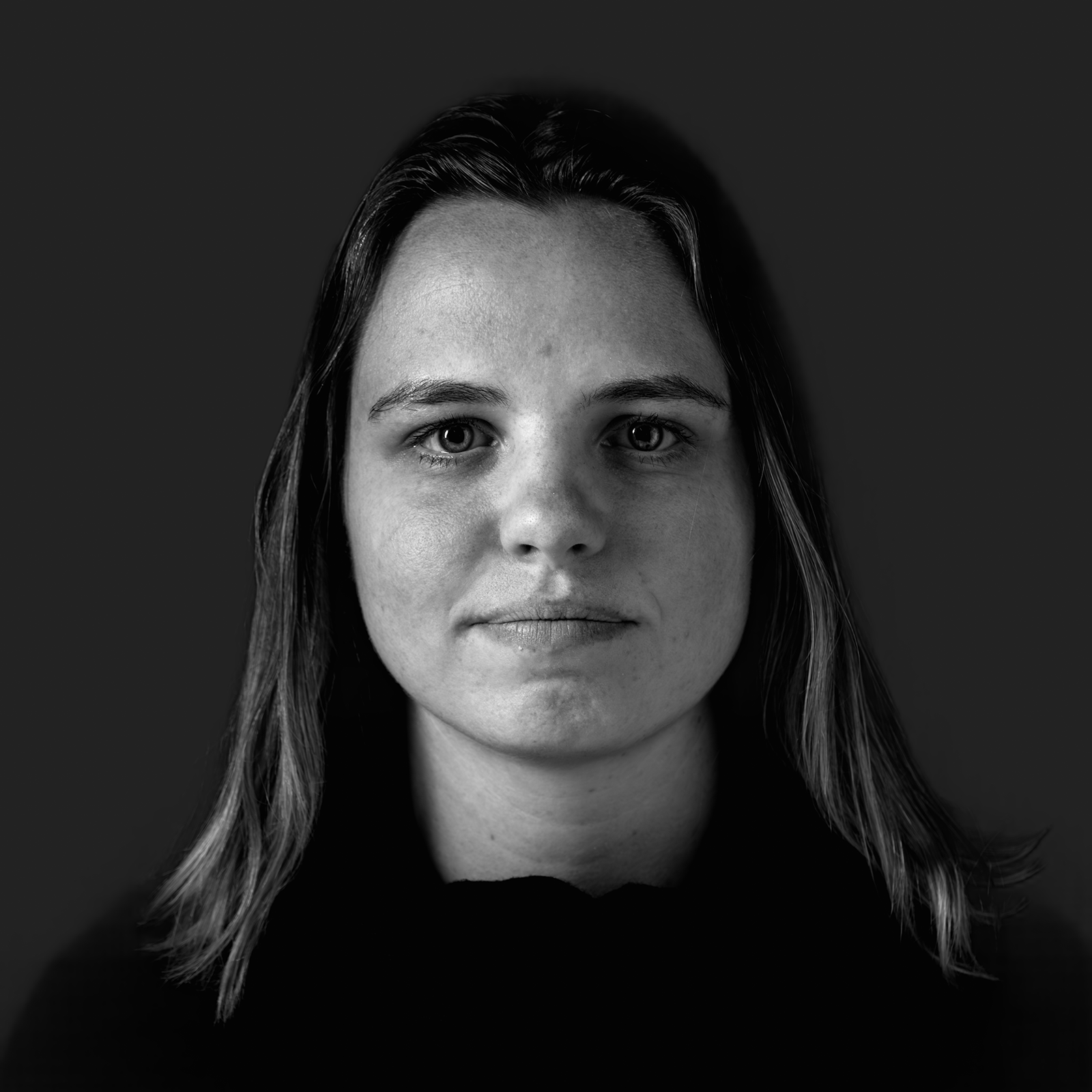 Black-and-white Colbe team portrait against a softly raised dark background