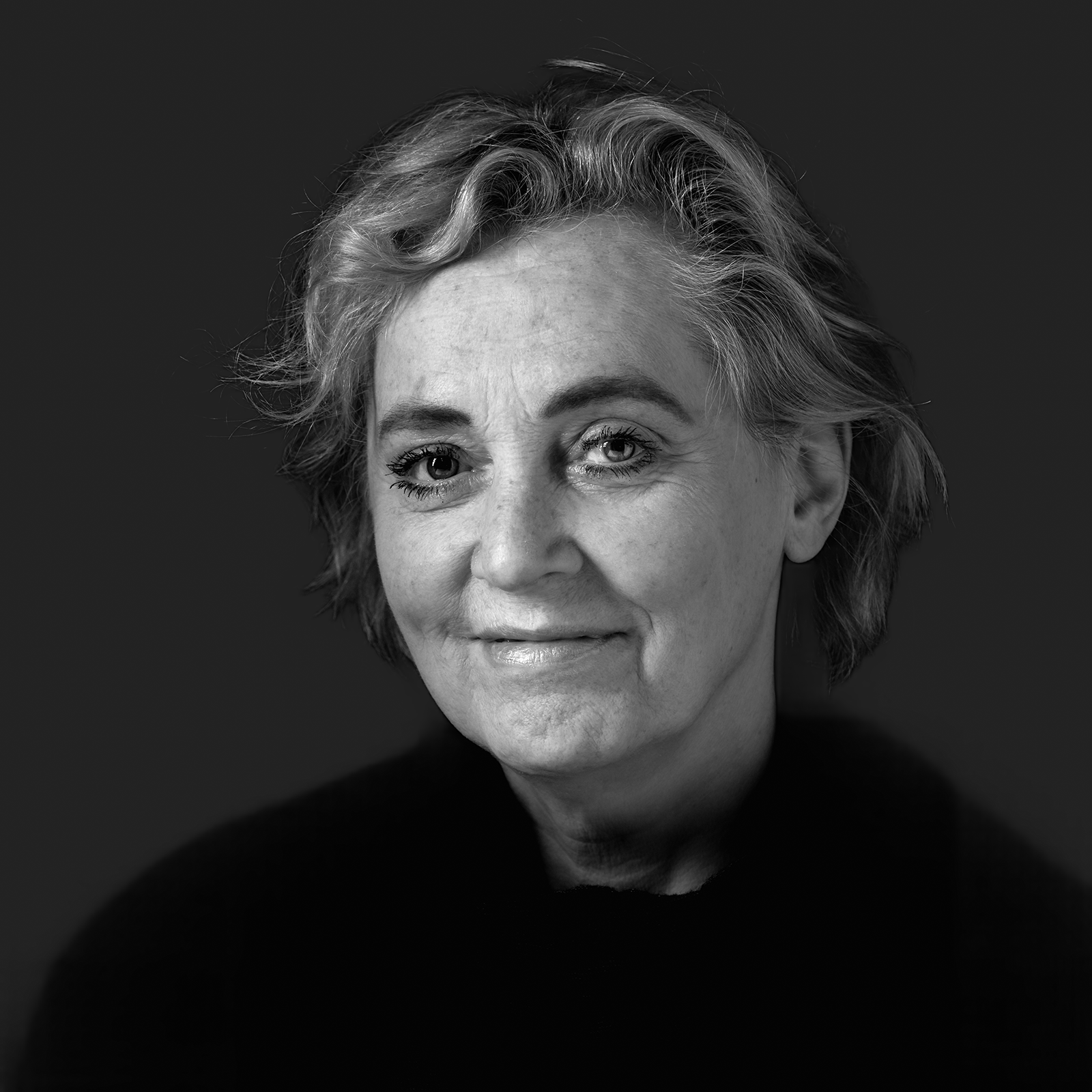 Black-and-white Colbe team portrait against a softly raised dark background