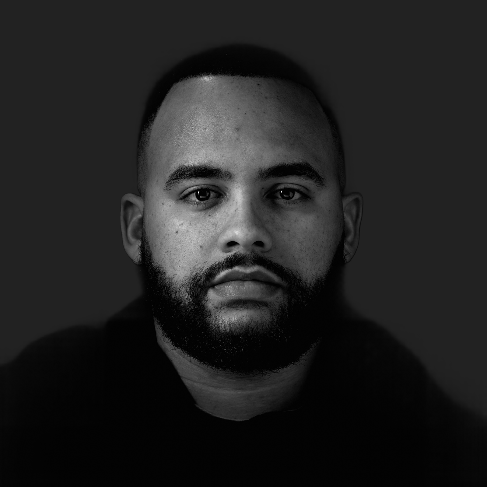 Black-and-white Colbe team portrait against a softly raised dark background