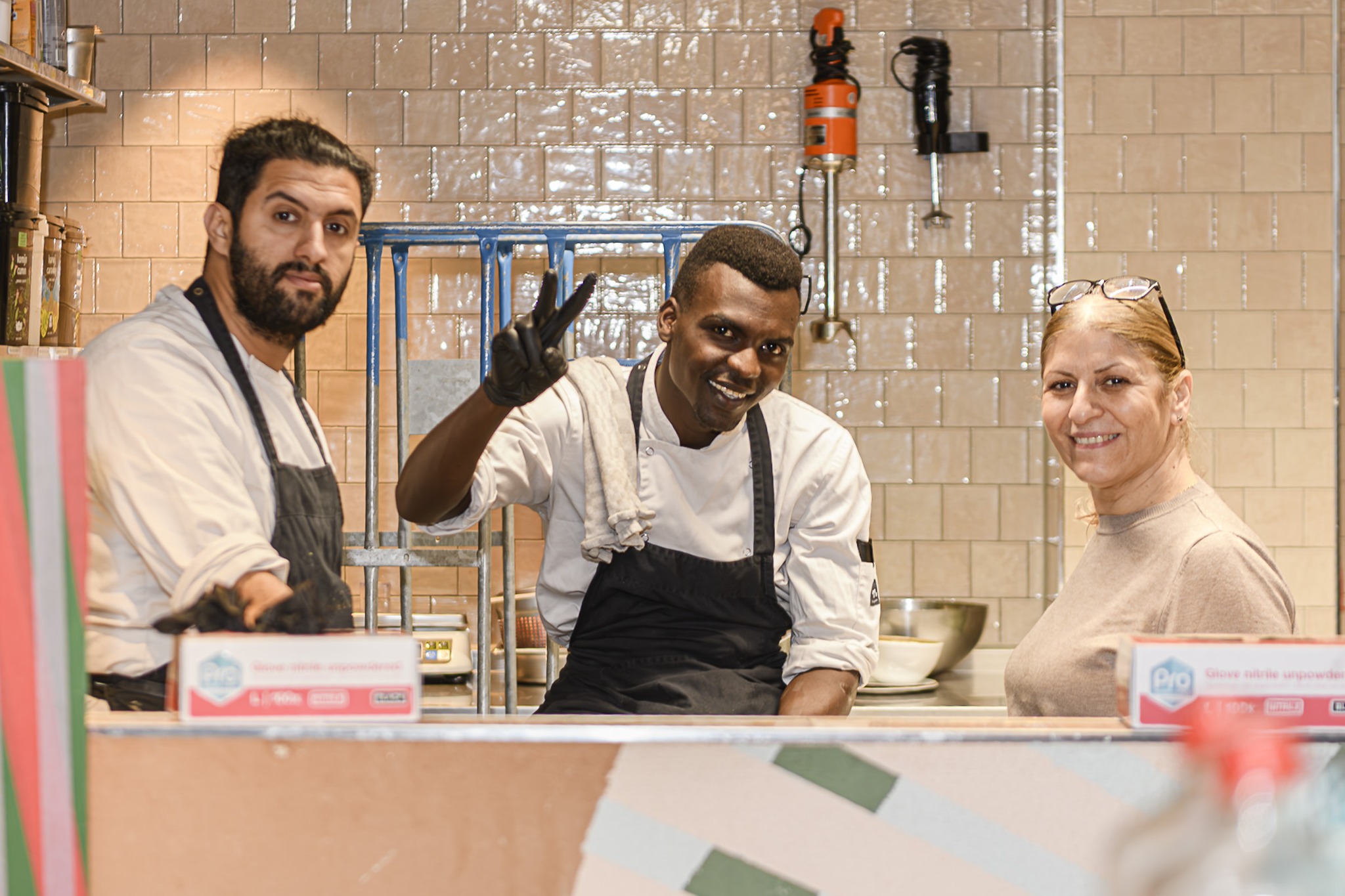Three A Beautiful Mess colleagues in their kitchen