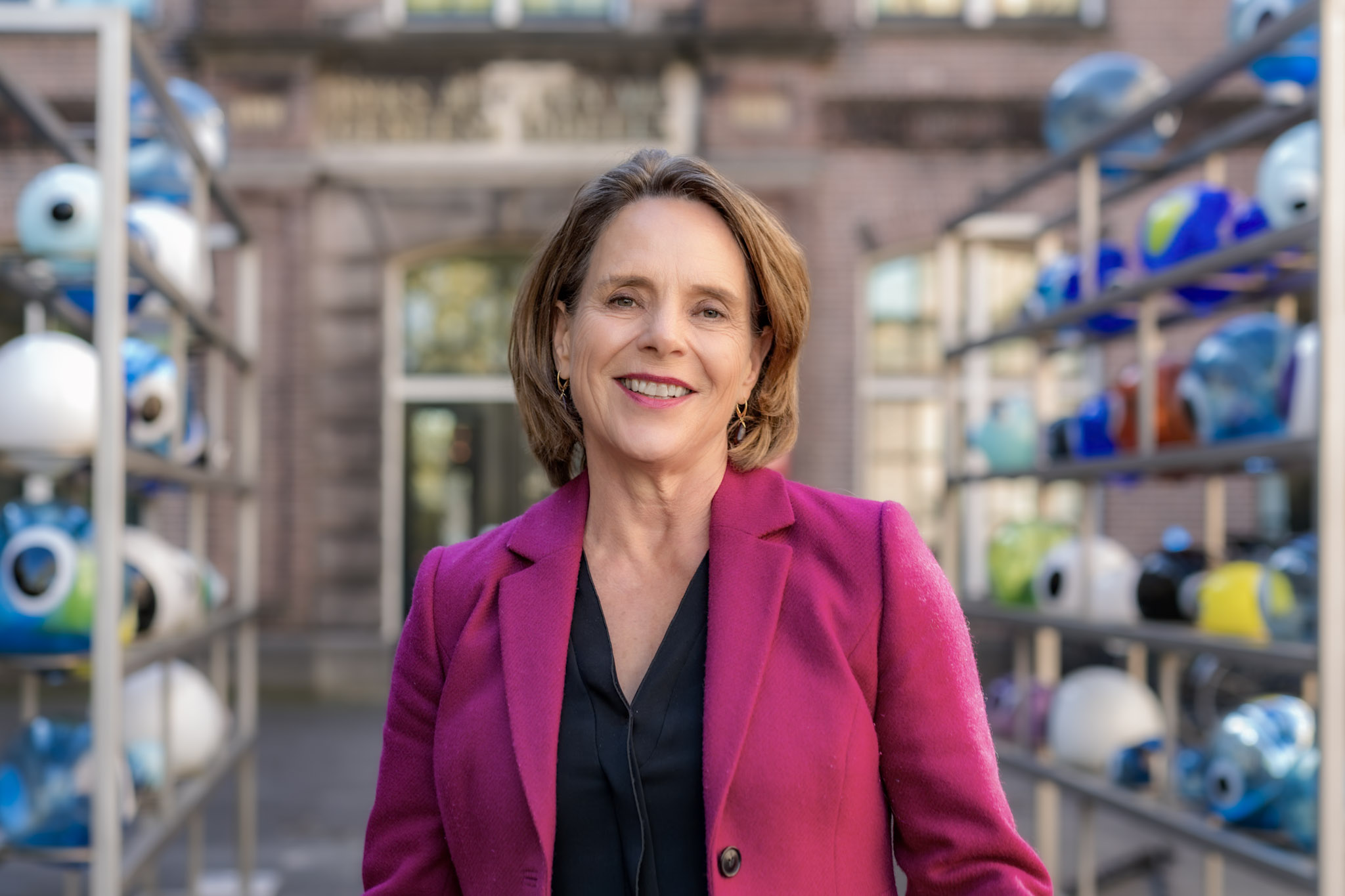 Relaxed leadership portrait of a woman in her working environment